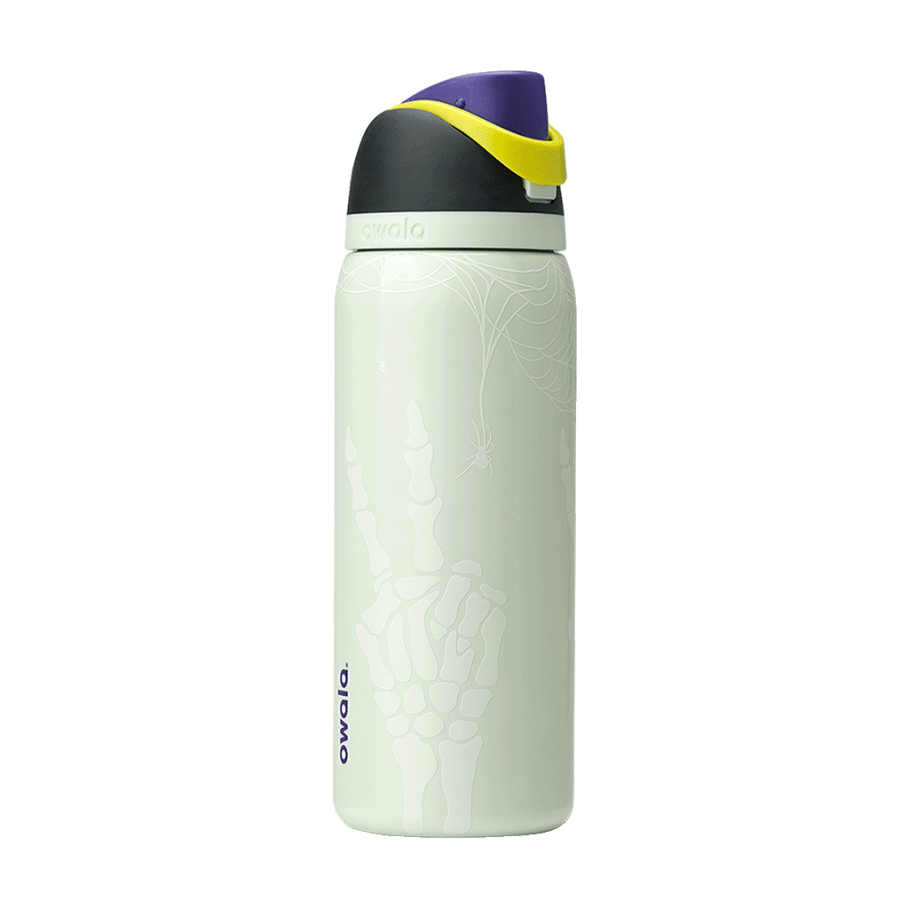 Owala FreeSip 32oz in RIP, pale mint insulated stainless steel body with white spider web, spider, and skeleton hand glow print, black lid, purple flip cap and yellow carry loop; glows in the dark
